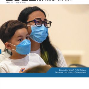 Cover Page of FY2022 Annual Report- shows a child sitting on his mom's lap. Both are wearing white t-shirts and blue COVID-19 face masks.